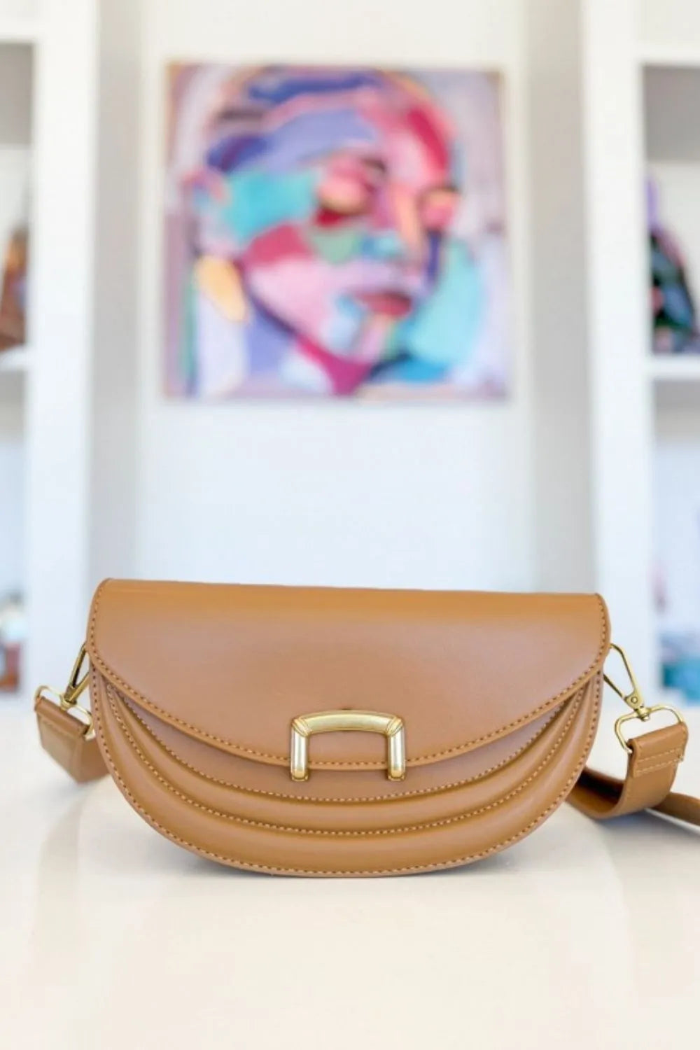 Crescent crossbody bag with buckle detail